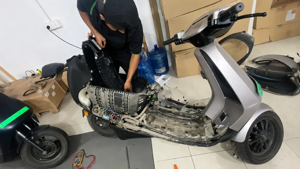 Ola electric scooter battery pack removed for diagnostic inspection at a service centre